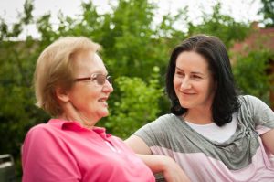 Carer giving praise to Dementia patient