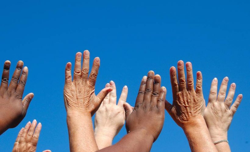 incontinent people putting hands in air
