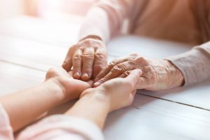 older-and-younger-woman-holding-hands older and younger woman incontinence