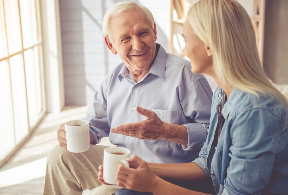 girl-talking-to-man-with-dementia-incontinence